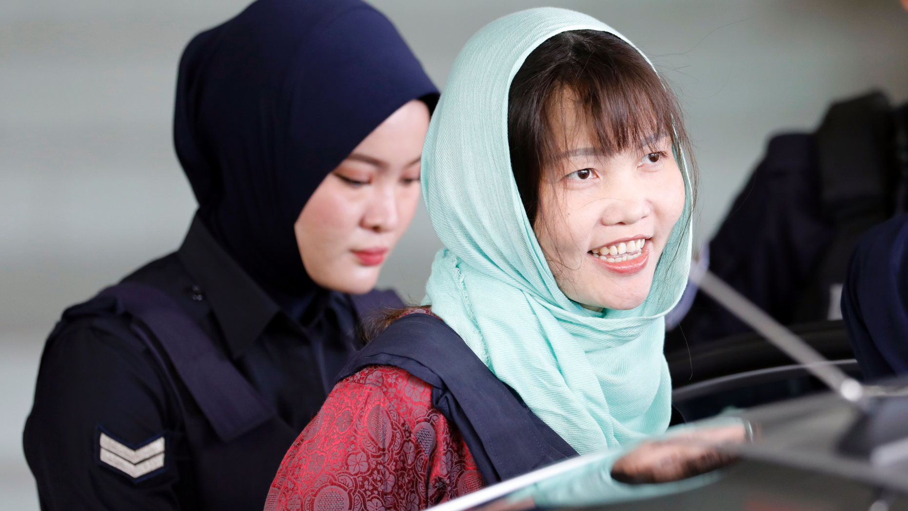 Vietnamese Doan Thi Huong, right, leaves Shah Alam High Court in Shah Alam, Malaysia, Monday, April 1, 2019. The Vietnamese woman who is the only suspect in custody for the killing of the North Korean leader's brother Kim Jong Nam pleaded guilty to a lesser charge in a Malaysian court on Monday and her lawyer said she could be freed as early as next month. (AP Photo/Vincent Thian)