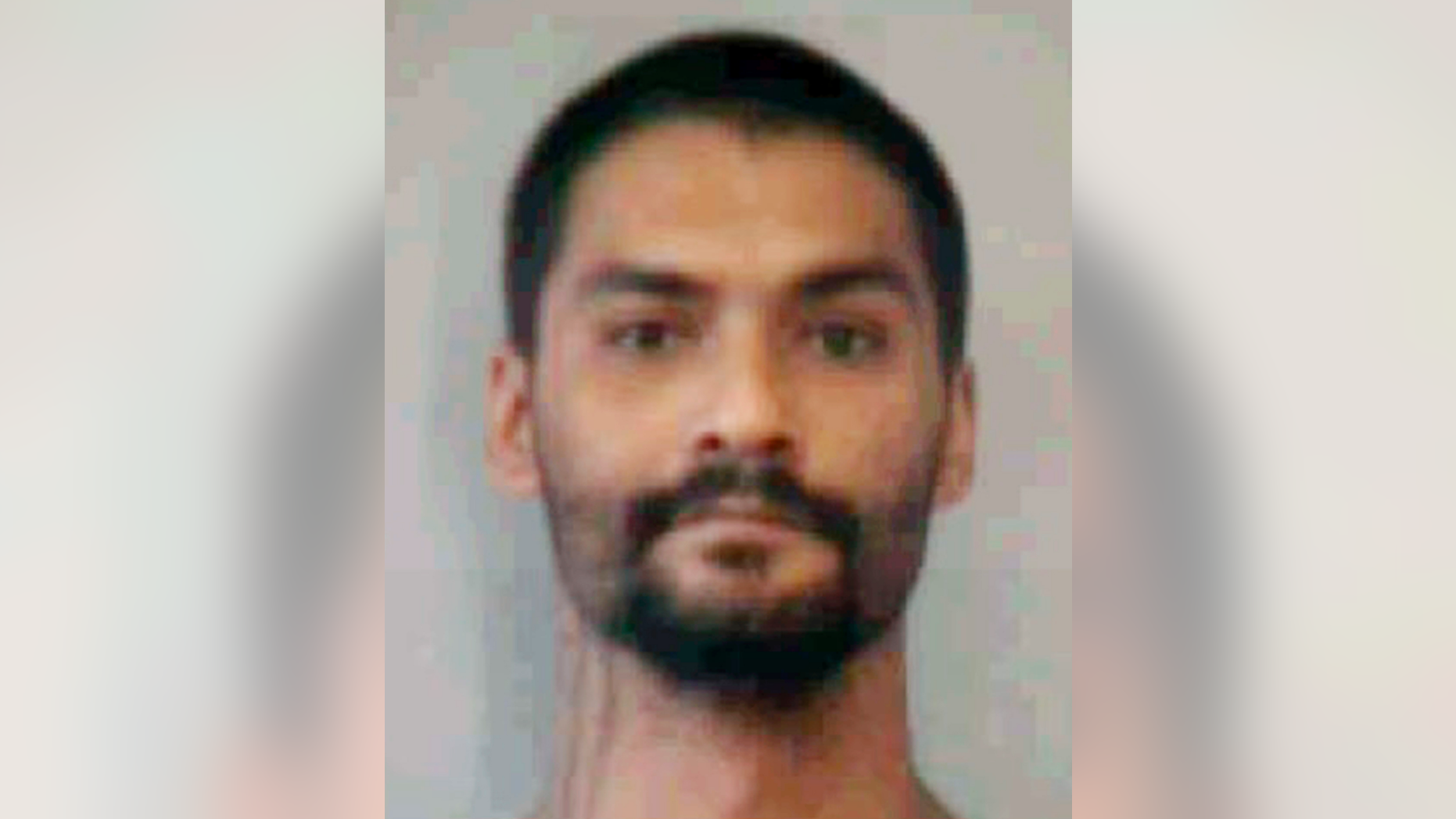 This undated booking photo provided by the Hawaii Department of Public Safety shows Troy Diego. Diego is one of two inmates who escaped from a Maui jail Sunday, April 14, 2019. He and Barret Paman escaped from Maui Community Correctional Center. Authorities say staff members later noticed a broken door in the back of a dorm building. Paman later turned himself in to Maui police. He's awaiting trial for burglary, theft and firearms charges. Diego remained missing Monday. He's awaiting trial for theft and unauthorized entry into a vehicle. (Hawaii Department of Public Safety via AP)