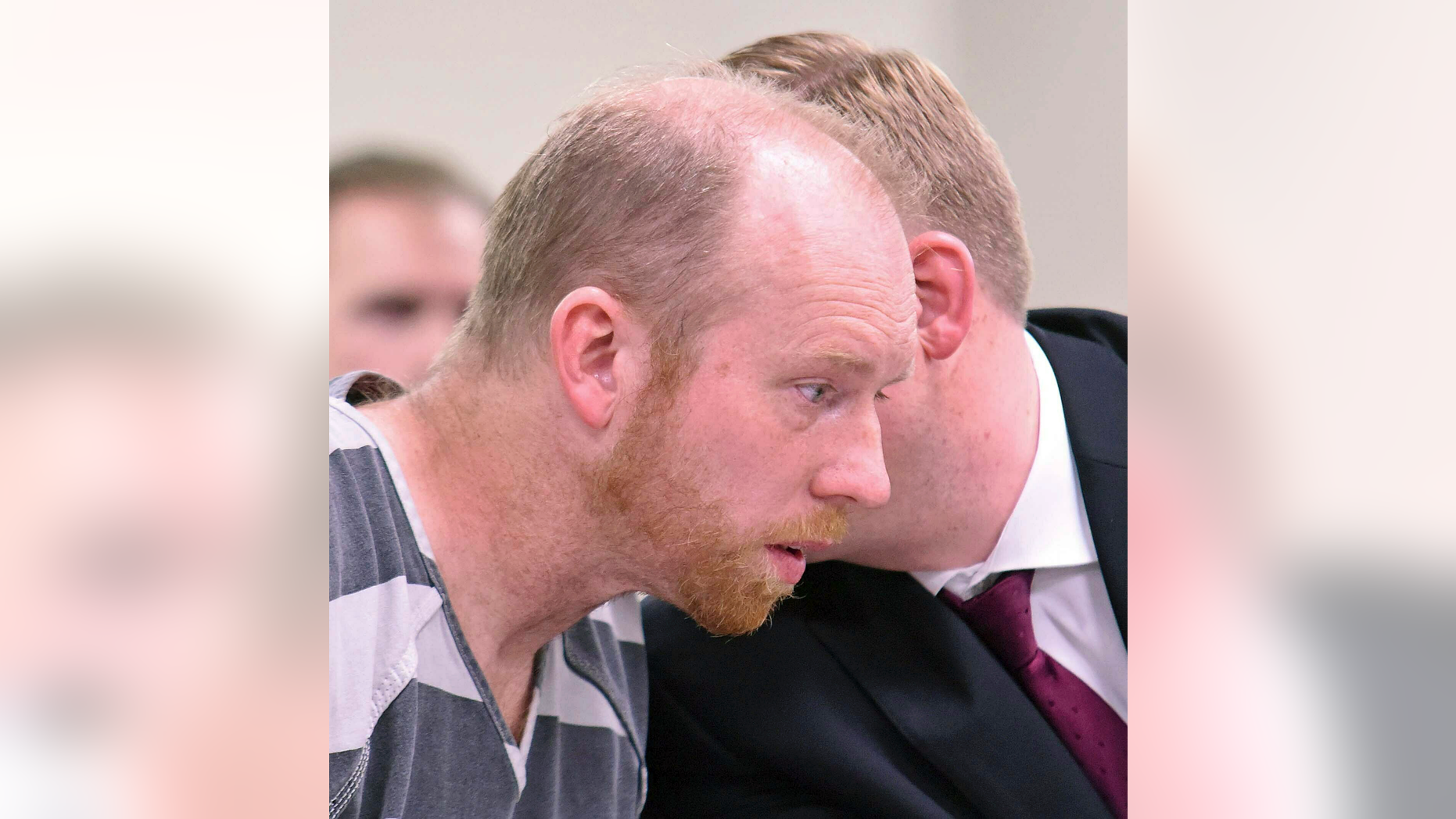 Chad Isaak listens to counsel in district court while being charged with four counts of class AA felony murder in district court on Friday, April 5, 2019, in Mandan, N.D. Isaak was arrested in Washburn on Thursday and charged with murdering four people in Mandan on Monday. He is being held on one million dollars bail. (Tom Stromme/The Bismarck Tribune via AP)