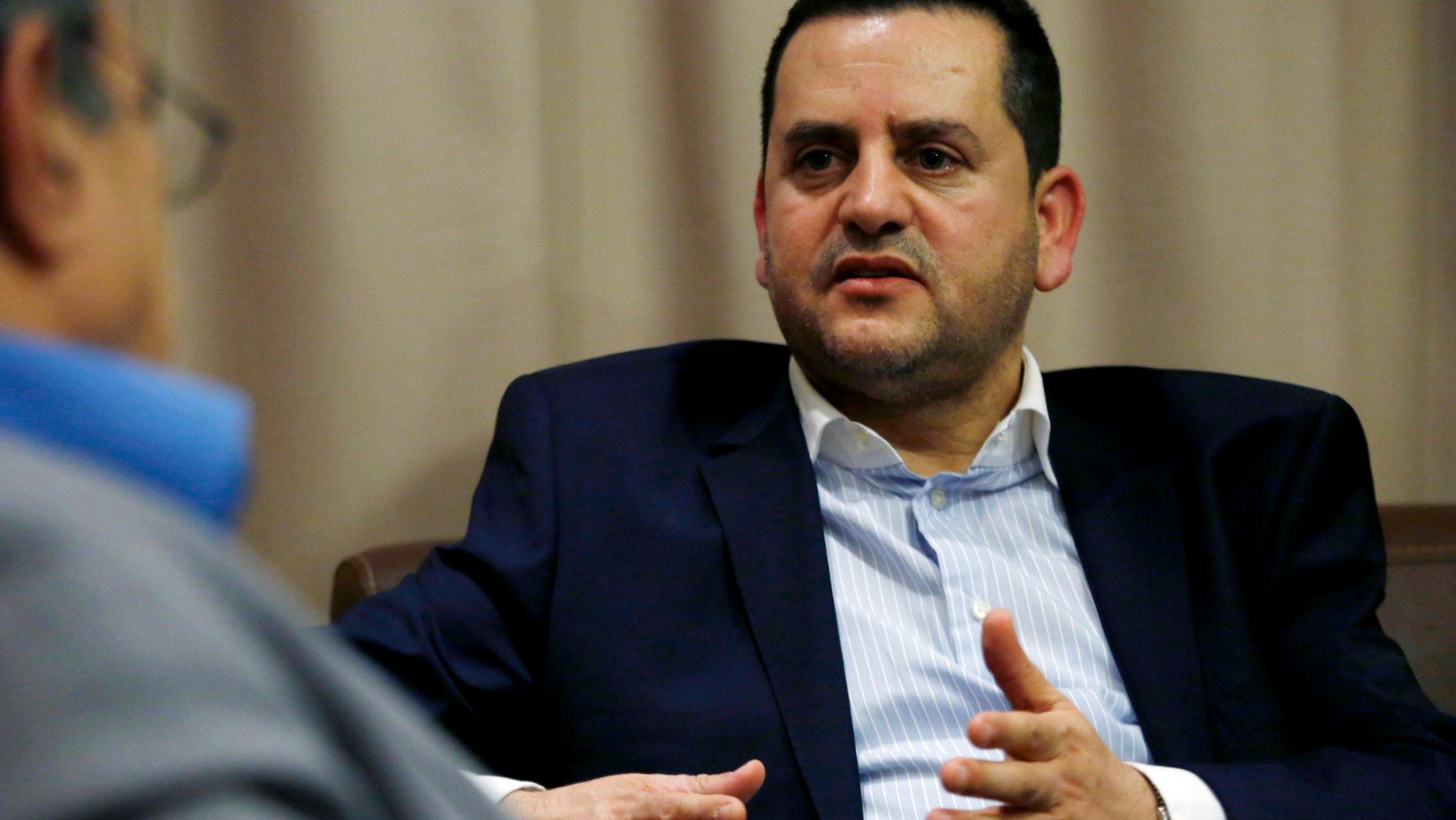 Abdelhadi al-Houij, Haftar's Minister of Foreign Affairs, speaks during an interview with The Associated Press, Sunday, April 21, 2019, in Tunis, Tunisia. President Donald Trump has spoken by phone with Libya's Field Marshal Khalifa Haftar, who is leading an offensive to take over the capital of Tripoli, the seat of the U.N.-supported government. (AP Photo/Hassene Dridi)