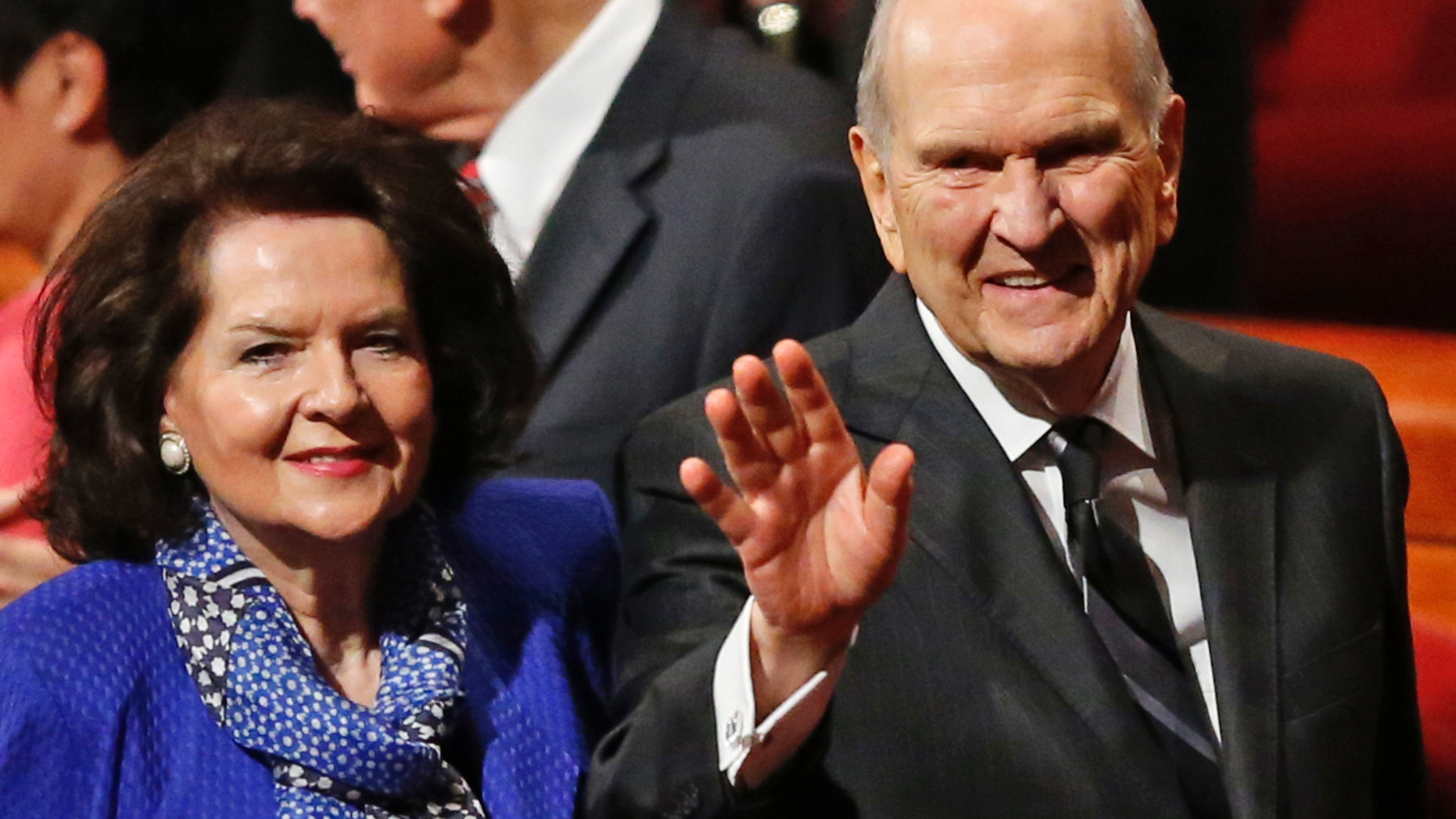 FILE - In this Oct. 6, 2018, file photo, President Russell M. Nelson and his wife, Wendy, wave as they leave the morning session of a twice-annual conference of The Church of Jesus Christ of Latter-day Saints in Salt Lake City. Nelson has generated buzz in his first year by becoming one of the most visible presidents in modern church history and implementing a number of changes. (AP Photo/Rick Bowmer, File)