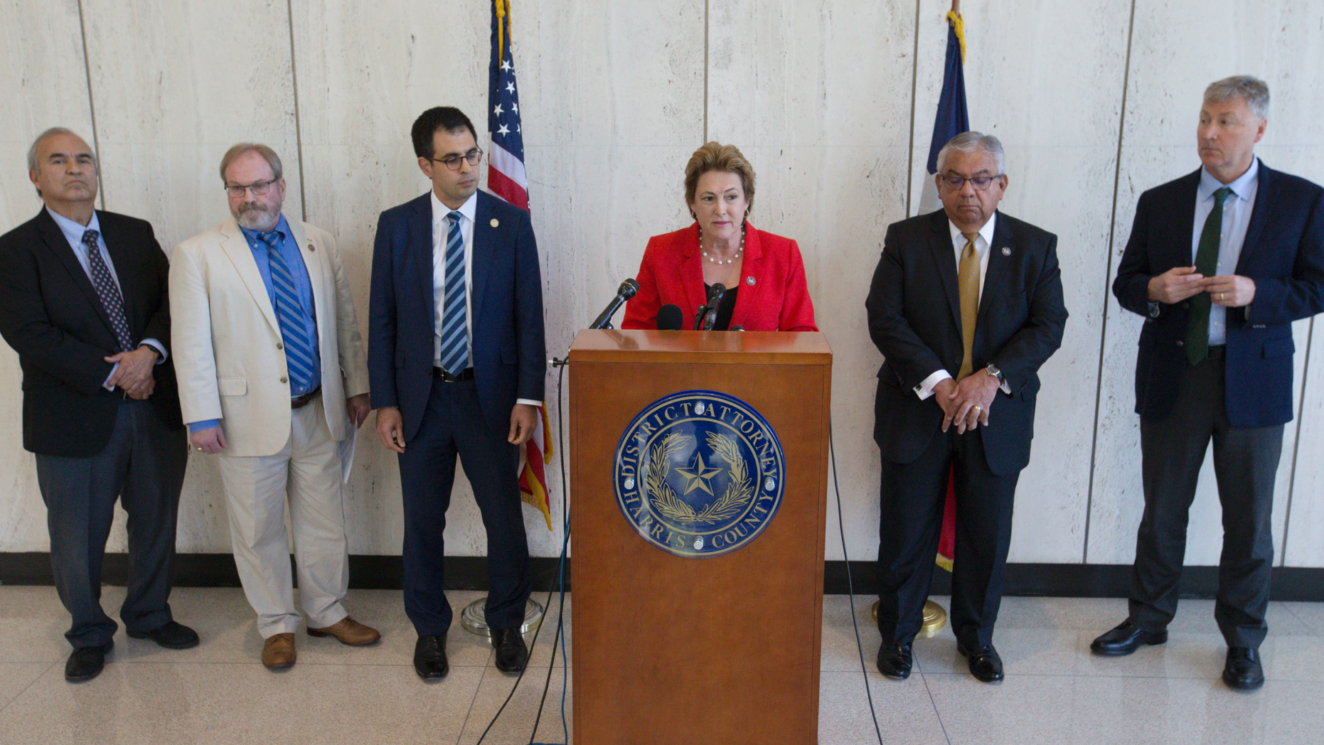 Harris County District Attorney Kim Ogg, center, announces that a grand jury decided to indict Arkema and Michael Keough, vice president of logistics division of the company, for reckless assault during a press conference on Wednesday, April 10, 2019, in Houston. Ogg said the trial will begin in May. (Yi-Chin Lee/Houston Chronicle via AP)