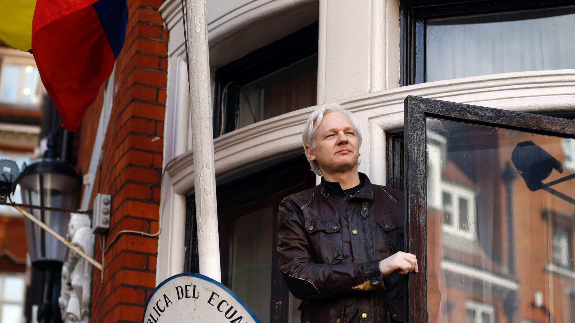 FILE- In this Friday May 19, 2017 file photo, WikiLeaks founder Julian Assange greets supporters outside the Ecuadorian embassy in London. Ecuador's President Lenin Moreno said on Tuesday, March 2, 2019, that he wants to reach an agreement for Assange to leave the Embassy in London as soon as possible, as long as his life is not in danger. (AP Photo/Frank Augstein, File)
