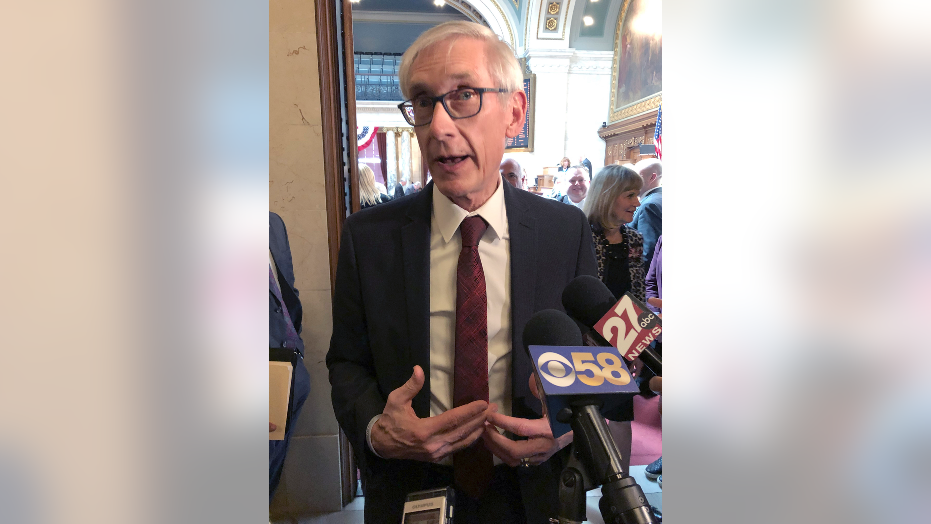 Wisconsin Gov. Tony Evers tells reporters that the Republican Senate leader is "huffing and puffing" for saying confirmation of Evers' Cabinet secretaries is in jeopardy because of an ongoing legal fight over a lame-duck legislative session on Tuesday, April 9, 2019, in Madison, Wisconsin. (AP Photo/Scott Bauer)