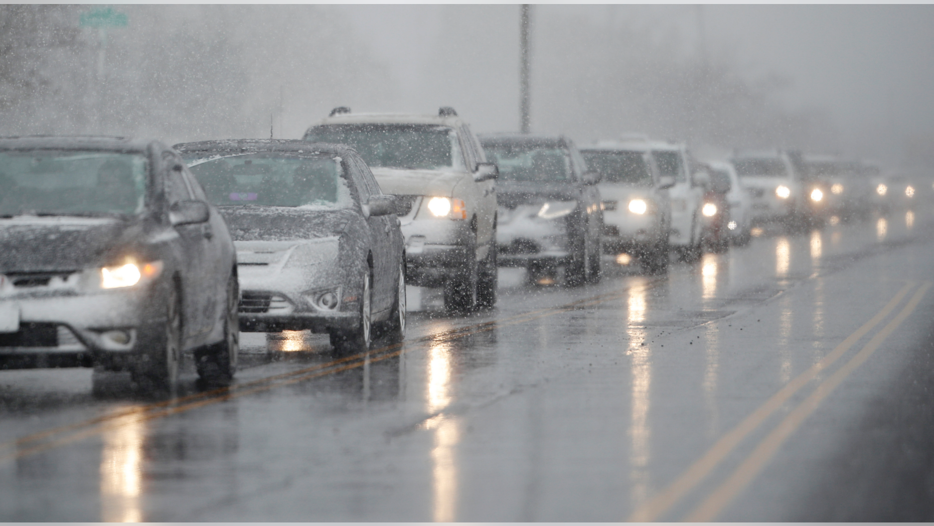 Traffic backs up along 56th Avenue as a spring storm rolls in before the evening rush hour Wednesday, April 10, 2019, in Denver. Blizzard warnings have been issued for the northern half of Colorado's heavily populated Front Range region, including Denver, as well as the state's northeastern plains through midday Thursday. (AP Photo/David Zalubowski)