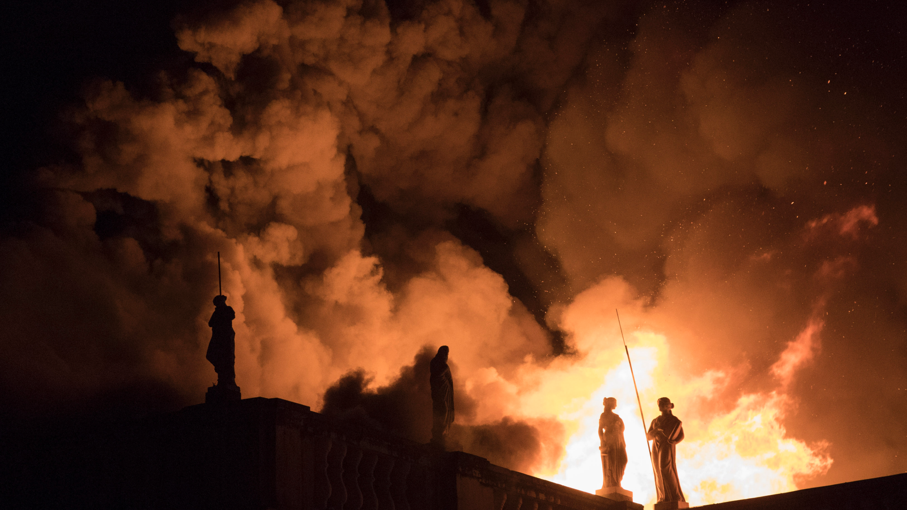 FILE - In this Sept. 2, 2018 file photo, flames engulf the 200-year-old National Museum of Brazil, in Rio de Janeiro. Federal police say an air conditioning unit is the “primary cause” of the fire that destroyed Brazil’s National Museum in Rio de Janeiro. Fire experts have presented the conclusions of a seven-month investigation into the Sept. 2, 2018 fire, which began in the museum’s auditorium and quickly spread to the rest of the building, destroying most of its 20 million artifacts. (AP Photo/Leo Correa, File)