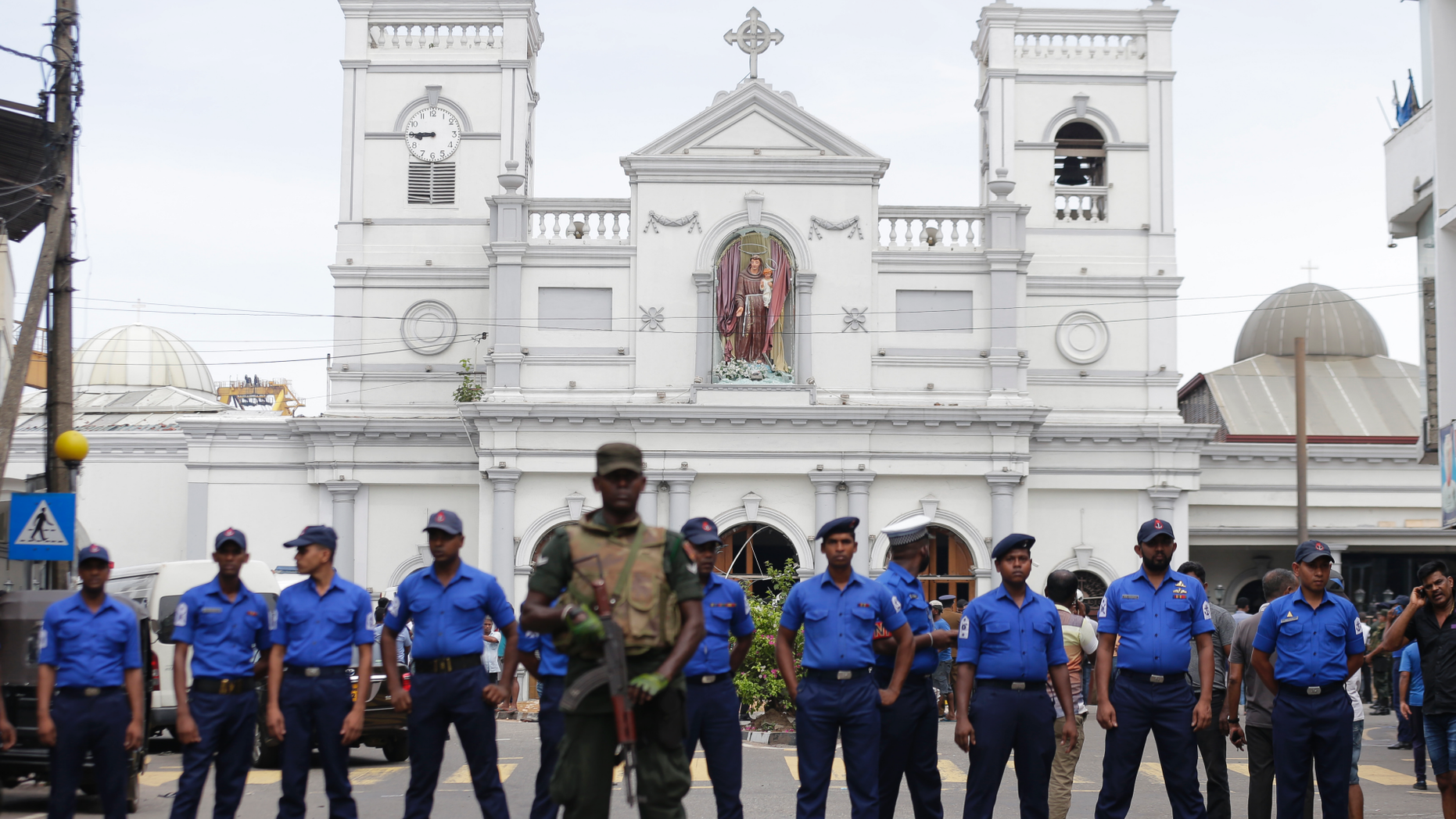 Sri Lankan Army soldiers secure the area around St. Anthony's Shrine after a blast in Colombo, Sri Lanka, Sunday, April 21, 2019. A Sri Lanka hospital spokesman says several blasts on Easter Sunday have killed dozens of people. (AP Photo/Eranga Jayawardena)