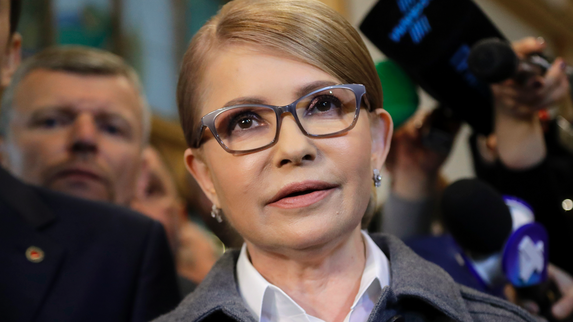 Former Ukrainian Prime Minister Yulia Tymoshenko, a candidate for the presidential elections, talks to the media after casting her ballot at a polling station during the presidential election in Kiev, Ukraine, Sunday, March 31, 2019. Ukrainians choose from among 39 candidates for a president they hope can guide the country of more than 42 million out of troubles including endemic corruption, a seemingly intractable conflict with Russia-backed separatists in the country's east and a struggling economy. (AP Photo/Sergei Grits)