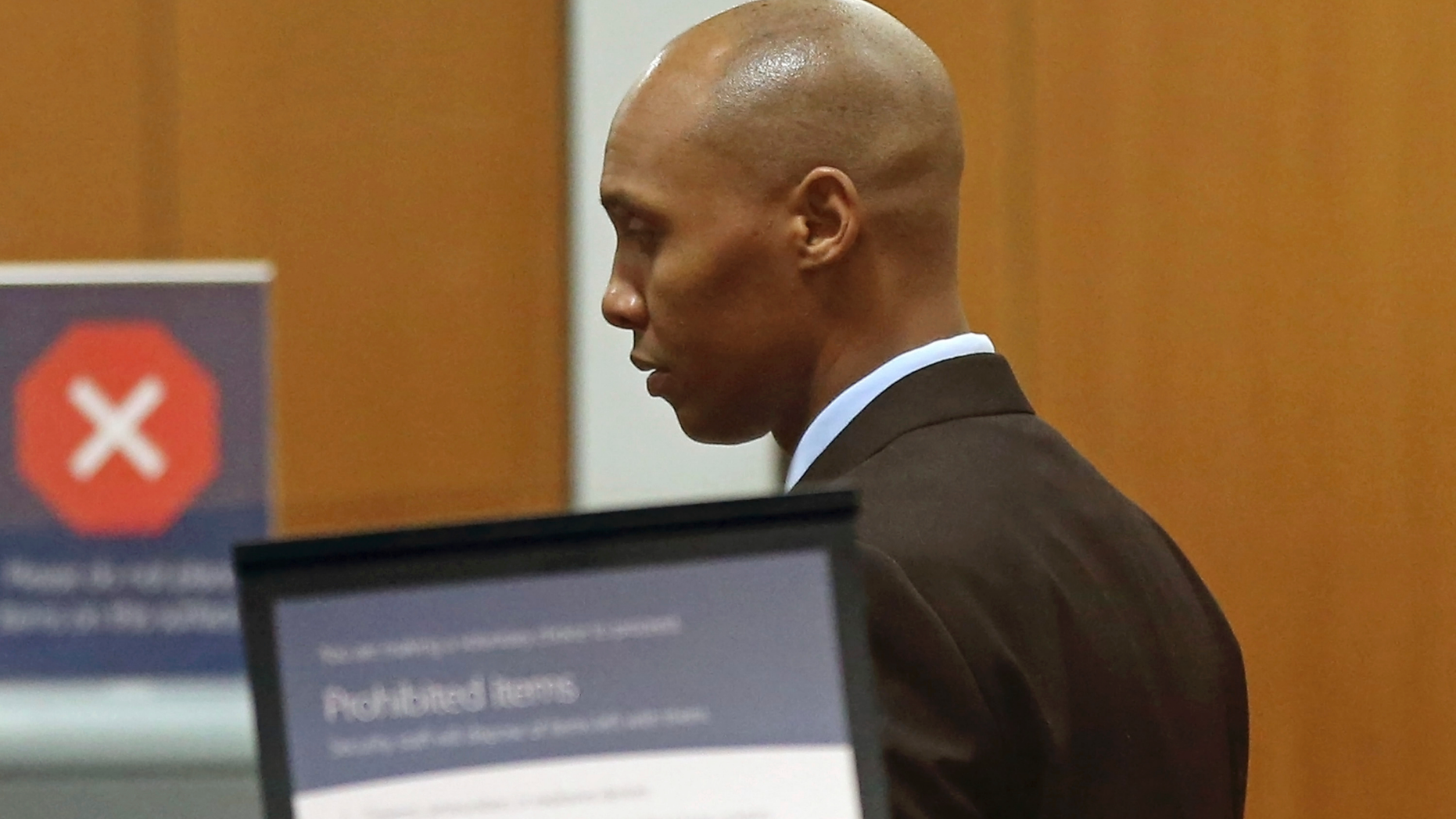 Mohamed Noor, the former Minneapolis police officer waits to go through security at the Hennepin County Government Center Thursday, March 25, 2019 in Minneapolis in the fourth week of his trial. Noor is charged with second-degree intentional murder, third-degree murder and second-degree manslaughter in the July 15, 2017, shooting death of Justine Ruszczyk Damond, a 40-year-old life coach and Australian-American who had called 911 to report a possible sexual assault behind her home. (AP Photo/Jim Mone)