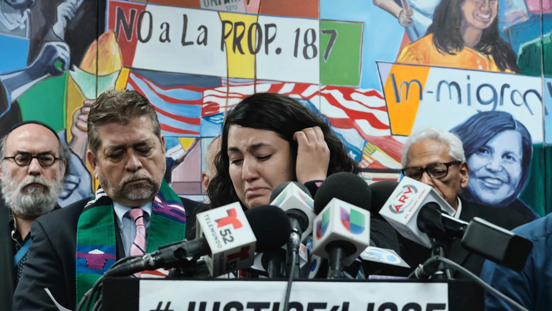 Melissa Castro tries to force back tears as she talks about her husband, Jose Luis Ibarra Bucio, while joined by local religious leaders during a news conference at the offices of the Coalition for Humane Immigrant Rights of Los Angeles (CHIRLA), Wednesday, April 10, 2019, in Los Angeles. The family of the 27-year-old man who died after a short stint in a California immigration detention facility demanded answers Wednesday about what happened to him and the timing of his release. Melissa Castro said her husband, was released as his health deteriorated from a brain hemorrhage and while he was in a coma from which he never awoke. (AP Photo/Richard Vog)el