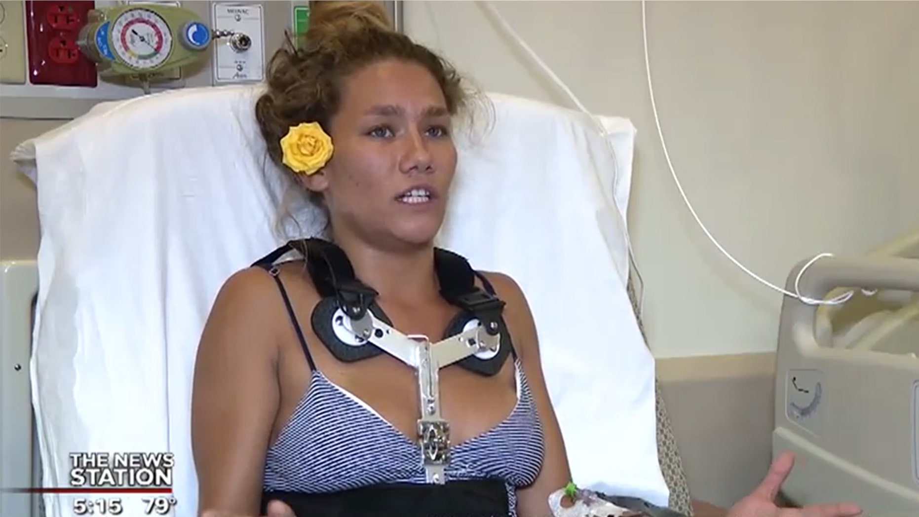 A woman reportedly broke her back and her foot when she jumped into the water to rescue a boy who was struggling against a rip current.