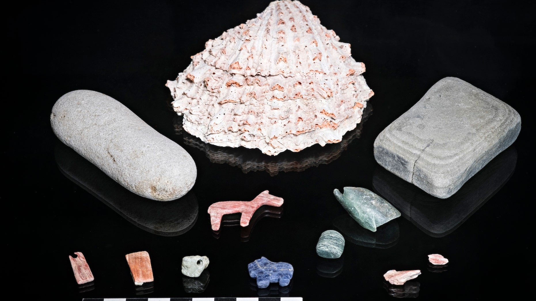 The researchers discovered semi-precious stone artifacts, including a lapis-lazuli puma figurine, at the bottom of the lake.