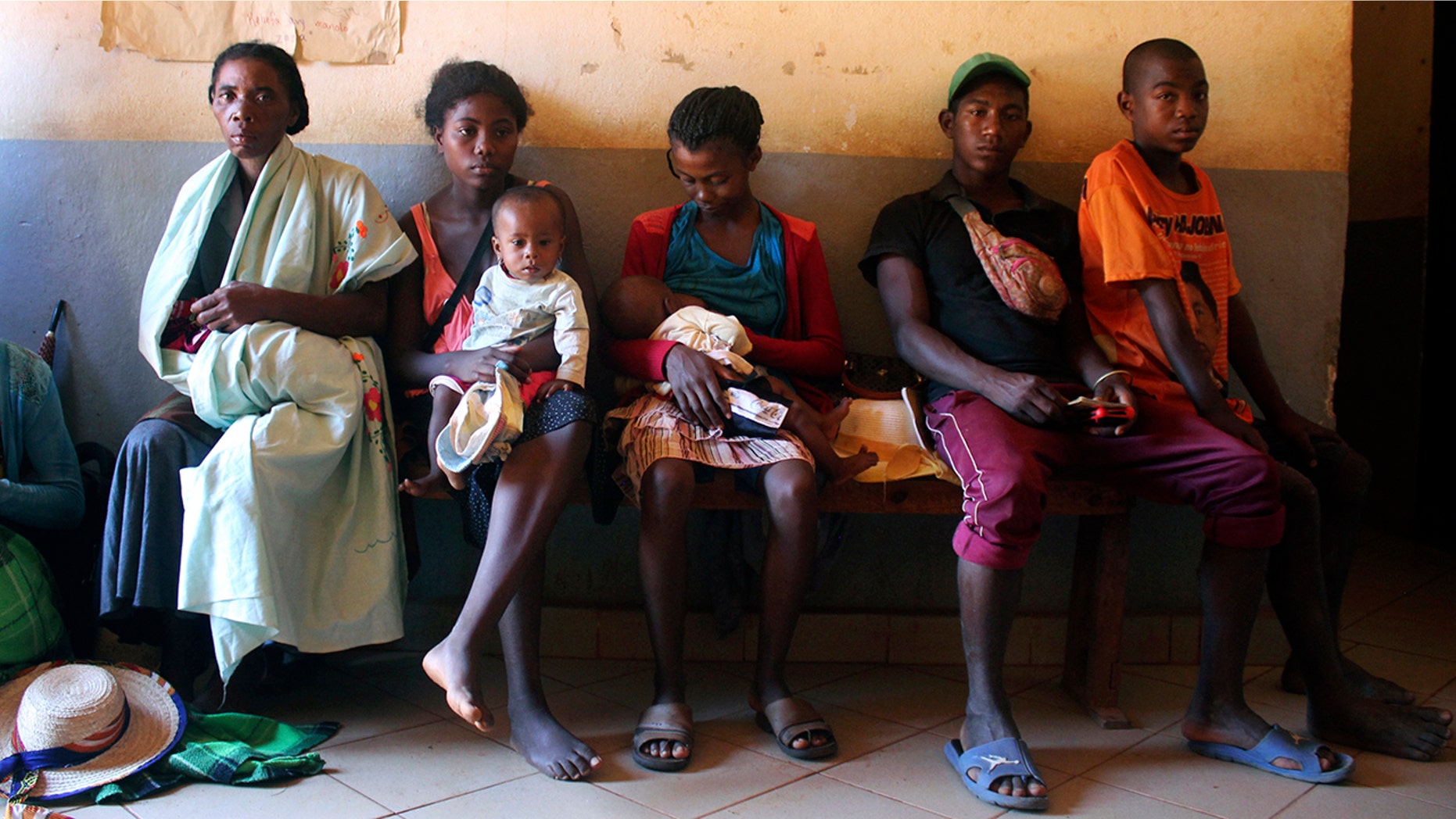 Mothers are waiting for measles immunization at a health center in Larintsena, Madagascar, on March 21, 2019. While the island country is facing the largest measles outbreak in its history, the number of cases exceeds largely 115,000 people.