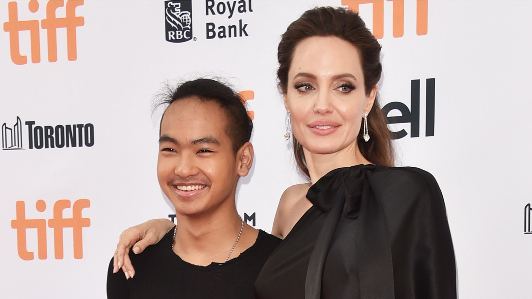Angelina Jolie and her son Maddox Jolie-Pitt (L).