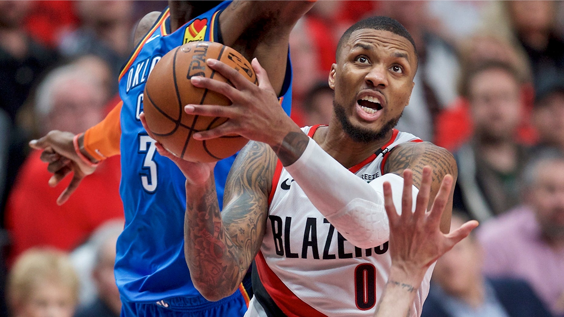 Portland Trail Blazers guard Damian Lillard, right, shoots in front of Oklahoma City Thunder forward Nerlens Noel during the second half of Game 2 of an NBA basketball first-round playoff series Tuesday, April 16, 2019, in Portland, Ore. (AP Photo/Craig Mitchelldyer)