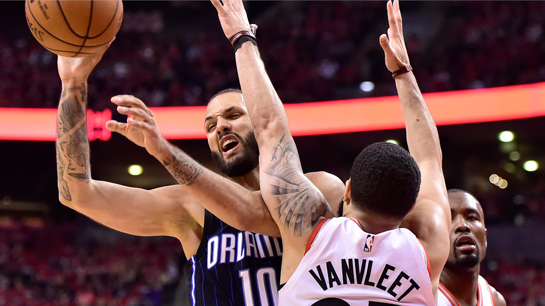 Orlando Magic guard Evan Fournier (10) controls the ball as Toronto Raptors guard Fred VanVleet (23) defends during the second half in Game 1 of a first-round NBA basketball playoff series in Toronto, Saturday, April 13, 2019. (Frank Gunn/The Canadian Press via AP)