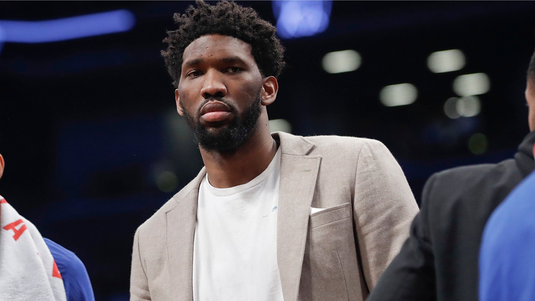 Philadelphia 76ers' Joel Embiid watches during the first half in Game 3 of the team's first-round NBA basketball playoff series against the Brooklyn Nets on Thursday, April 18, 2019, in New York. (AP Photo/Frank Franklin II)