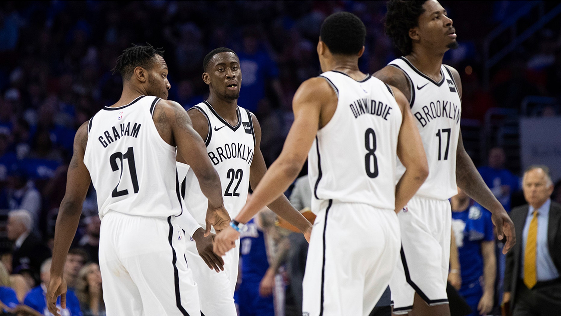 Brooklyn Nets' Caris LeVert, center left, celebrates with his teammates during the second half in Game 1 of a first-round NBA basketball playoff series against the Philadelphia 76ers, Saturday, April 13, 2019, in Philadelphia. The Nets won 111-102. (AP Photo/Chris Szagola)