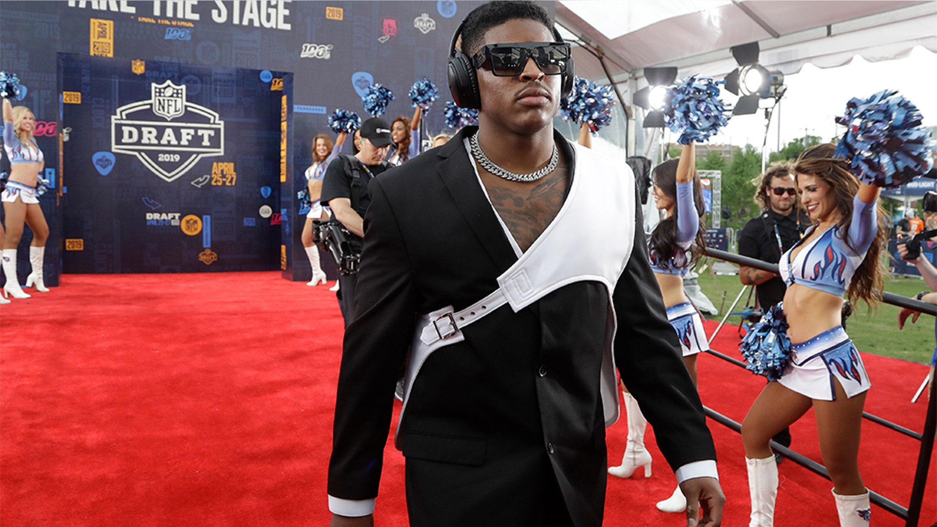Michigan linebacker Devin Bush walks the red carpet ahead of the first round at the NFL football draft, Thursday in Nashville, Tenn. (AP Photo/Steve Helber)