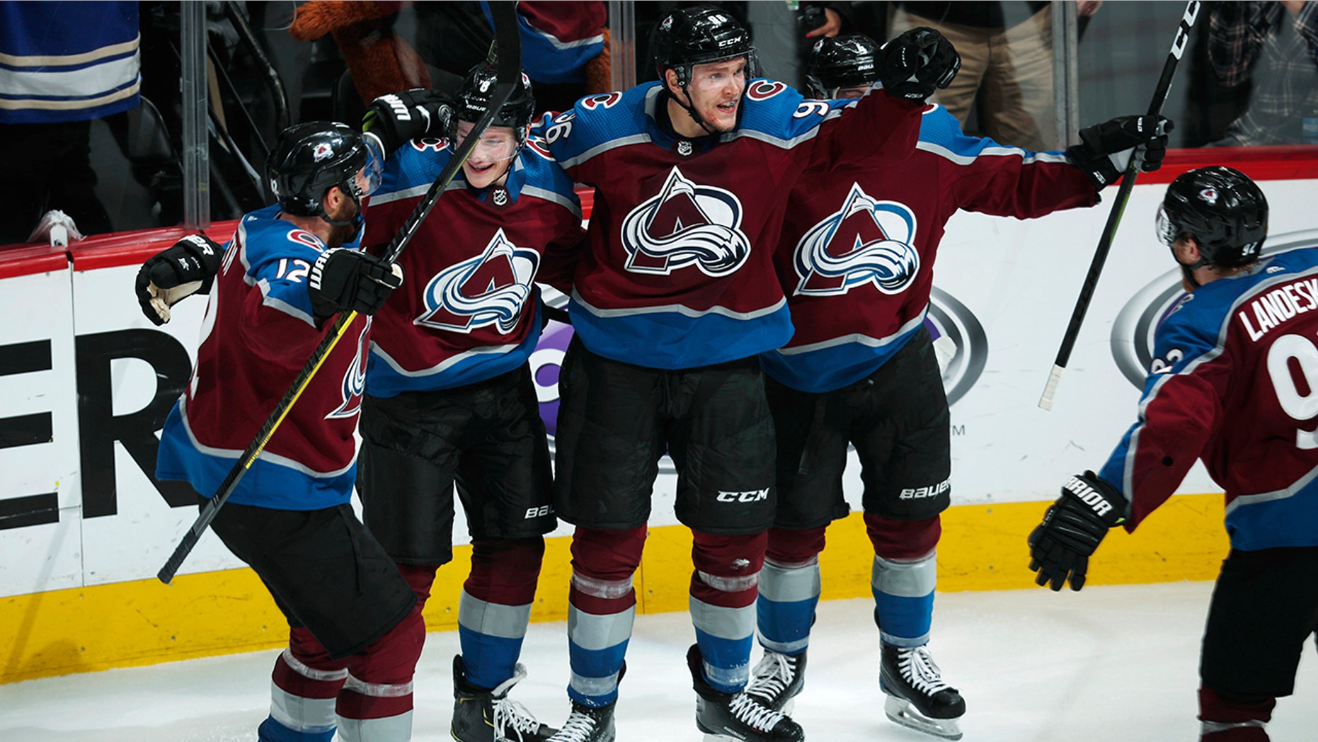 Colorado Avalanche right wing Mikko Rantanen, third from left, celebrates his overtime goal with, from left, defensemen Patrik Nemeth, Cale Makar and Tyson Barrie in Game 4 of the team's NHL hockey playoff series against Calgary Flames on Wednesday, April 17, 2019, in Denver. The Avalanche won 3-2. (AP Photo/David Zalubowski)