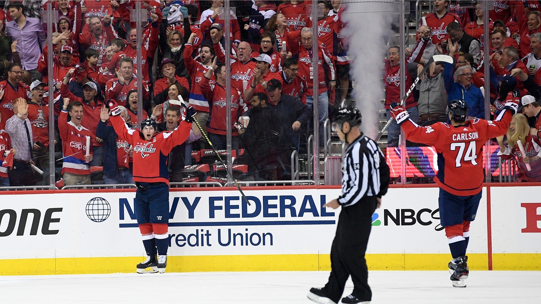 Washington Capitals center Nicklas Backstrom, left of Sweden, celebrates his goal with defenseman John Carlson (74) during the first period of Game 1 of an NHL hockey first-round playoff series against the Carolina Hurricanes, Thursday, April 11, 2019, in Washington. (AP Photo/Nick Wass)