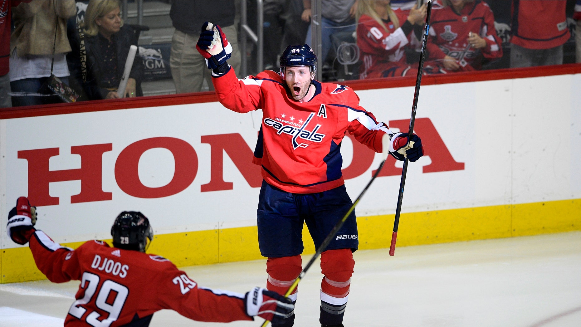 Washington Capitals defenseman Brooks Orpik (44) celebrates his game-winning goal with defenseman Christian Djoos (29), of Sweden, during overtime of Game 2 of an NHL hockey first-round playoff series against the Carolina Hurricanes, Saturday, April 13, 2019, in Washington. The Capitals won 4-3 in overtime. (AP Photo/Nick Wass)