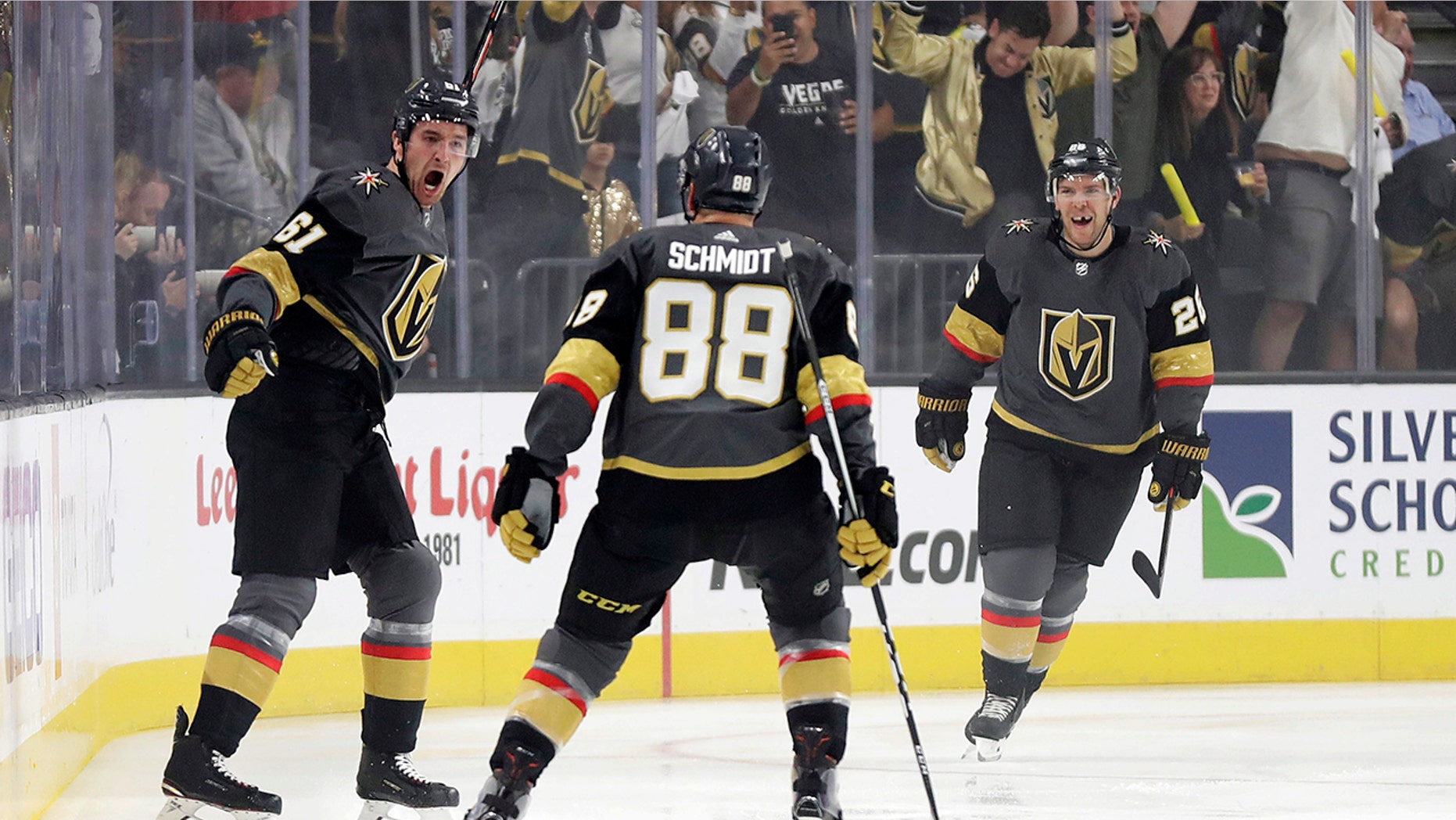 Vegas Golden Knights right wing Mark Stone, left, celebrates after scoring against the San Jose Sharks during the first period of Game 3 of an NHL first-round hockey playoff series game, Sunday, April 14, 2019, in Las Vegas. (AP Photo/Isaac Brekken)