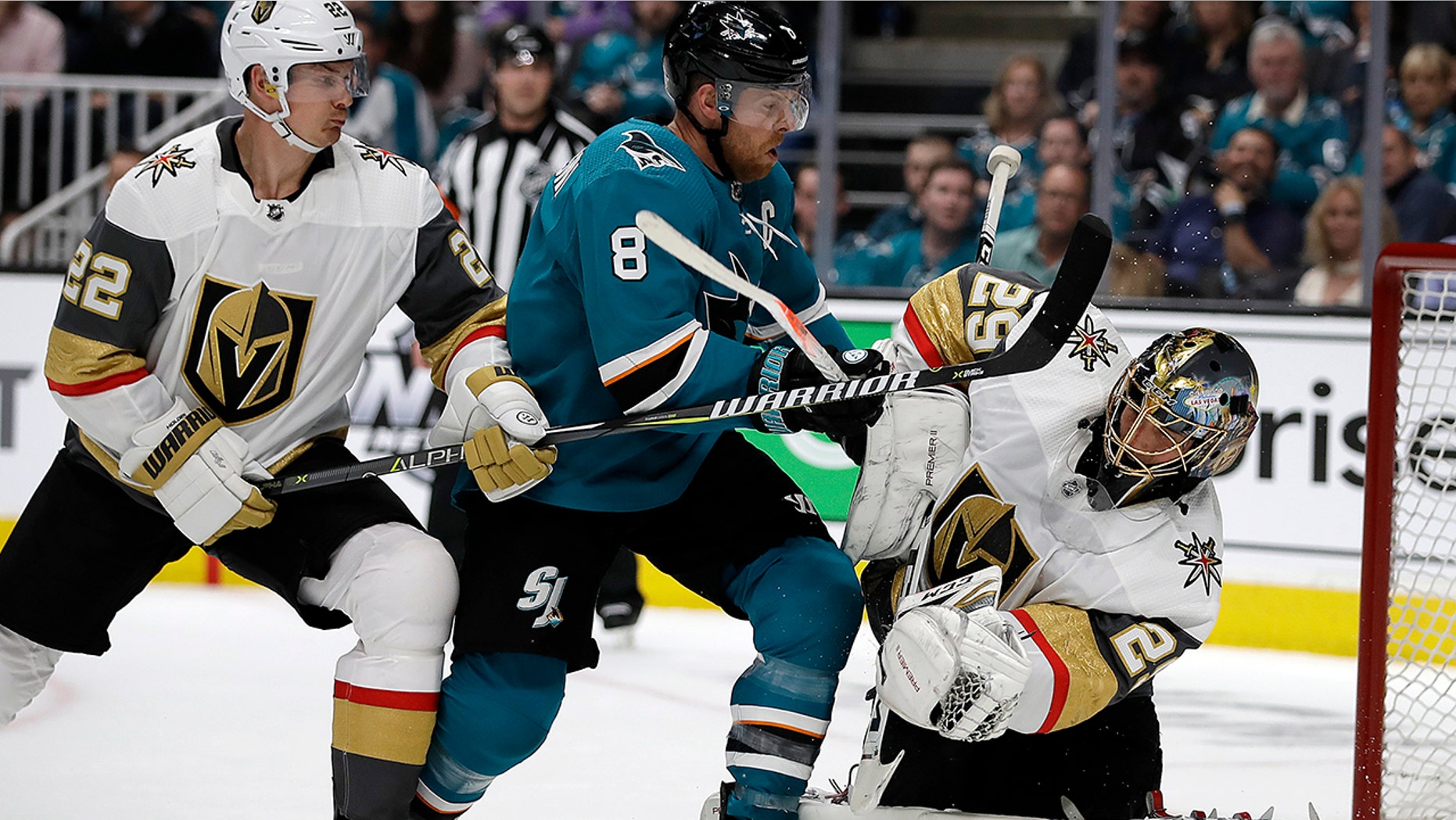 San Jose Sharks' Joe Pavelski (8) reacts after scoring a goal against Vegas Golden Knights goalie Marc-Andre Fleury, right, during the first period of Game 1 of an NHL hockey first-round playoff series Wednesday, April 10, 2019, in San Jose, Calif. At left is Golden Knights defenseman Nick Holden.