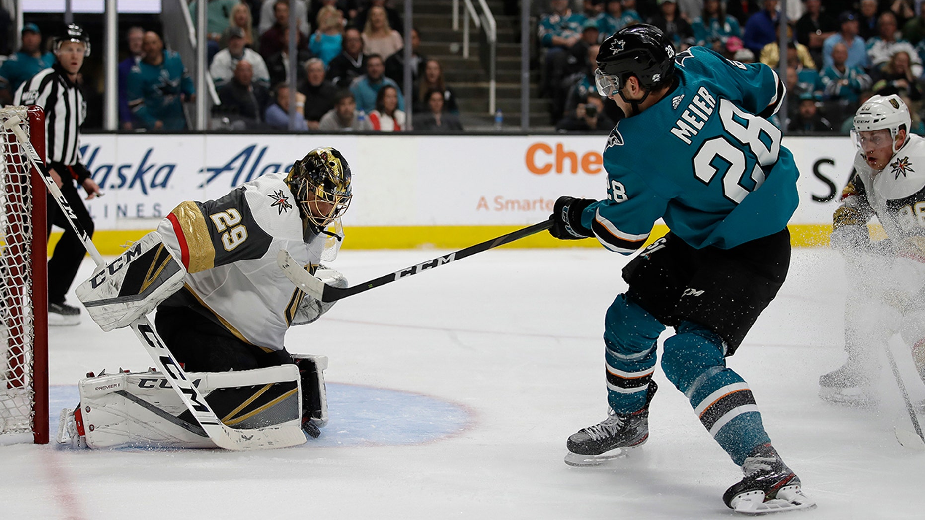 Vegas Golden Knights goalie Marc-Andre Fleury, left, blocks a shot from San Jose Sharks' Timo Meier (28) during the first period of Game 5 of an NHL hockey first-round playoff series Thursday, April 18, 2019, in San Jose, Calif. (AP Photo/Ben Margot)