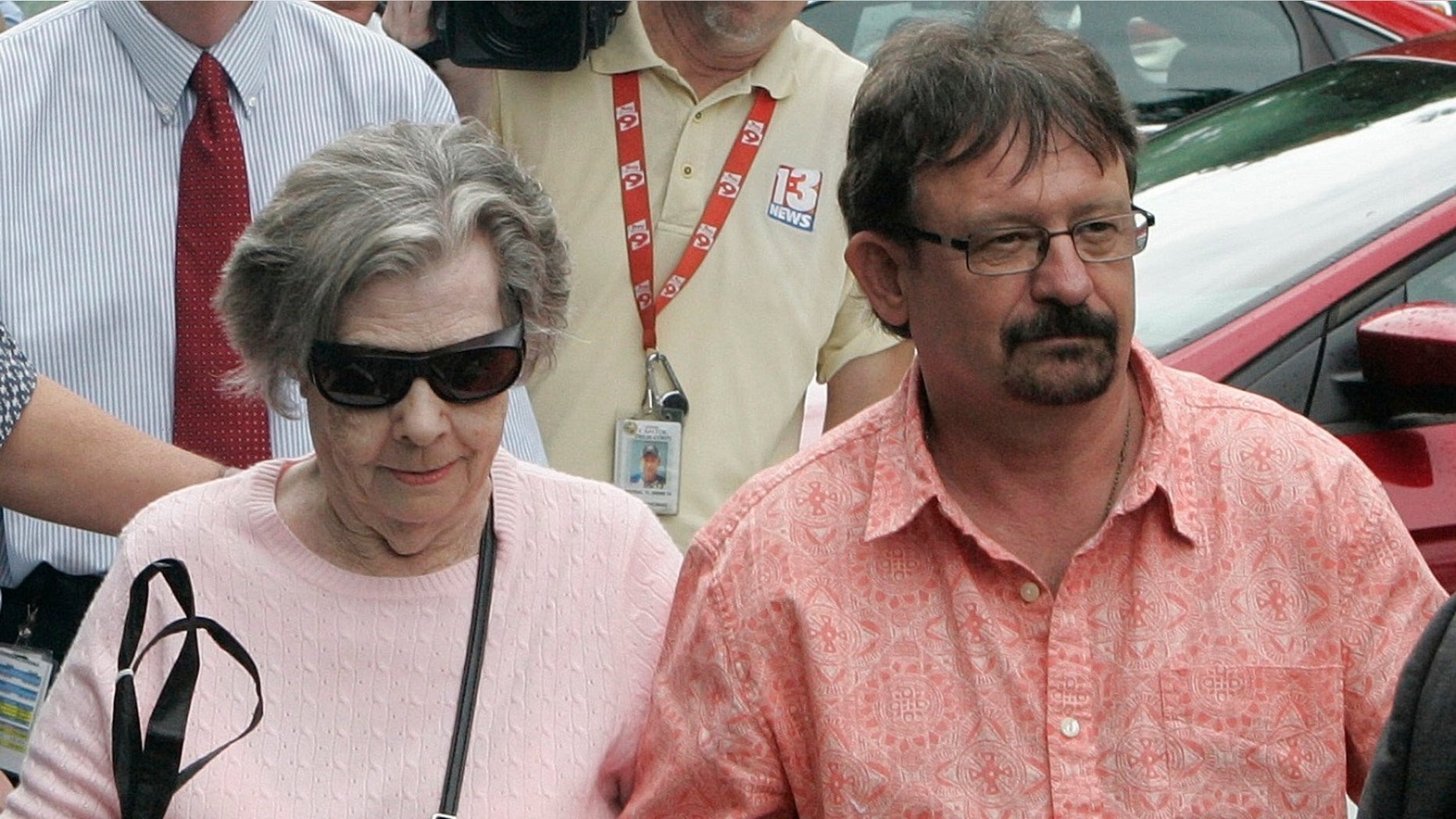 Gloria Mackenzie, 90, left, who took home $278 million from a winning Powerball ticket six years ago is suing her son, Scott Mackenzie and his financial advisers, claiming the money was put into low-return investments while she was being charged $2 million in fees.