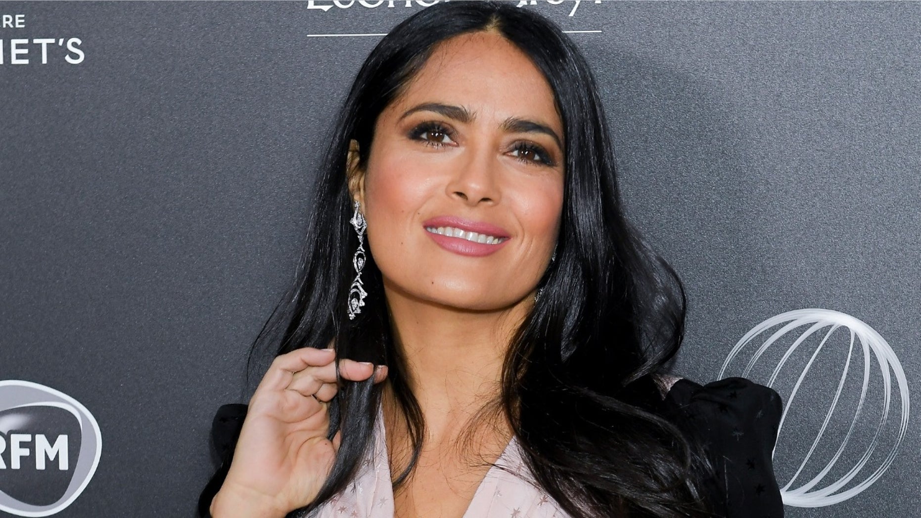 Actress Salma Hayek gave fans a sneak peek of her secret tattoo as part of her character in the upcoming film “The Hitman’s Wife’s Bodyguard.”