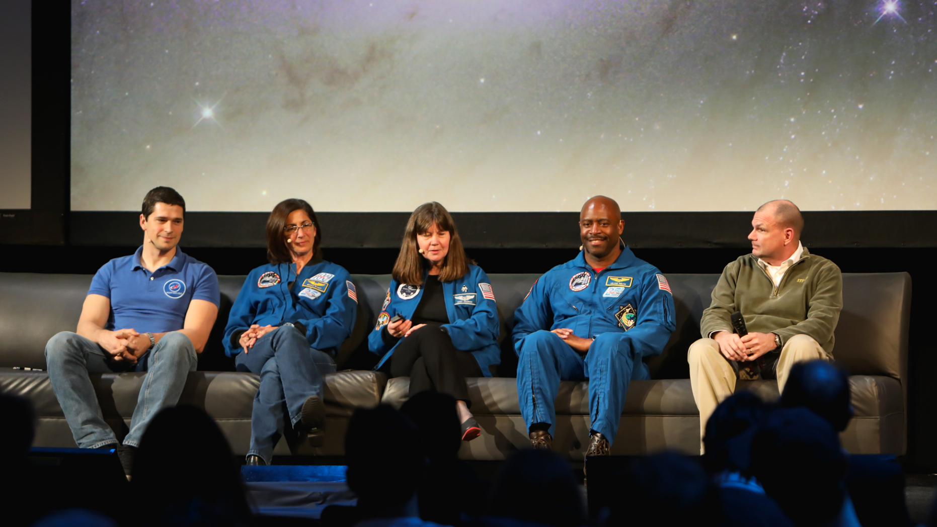 Cosmonaut Nikolay Chub and astronauts Nicole Stott, Cady Coleman, Leland Melvin and Tony Antonelli (left to right) lead the Beyond the Cradle 2019 event finale on March 14, 2019.