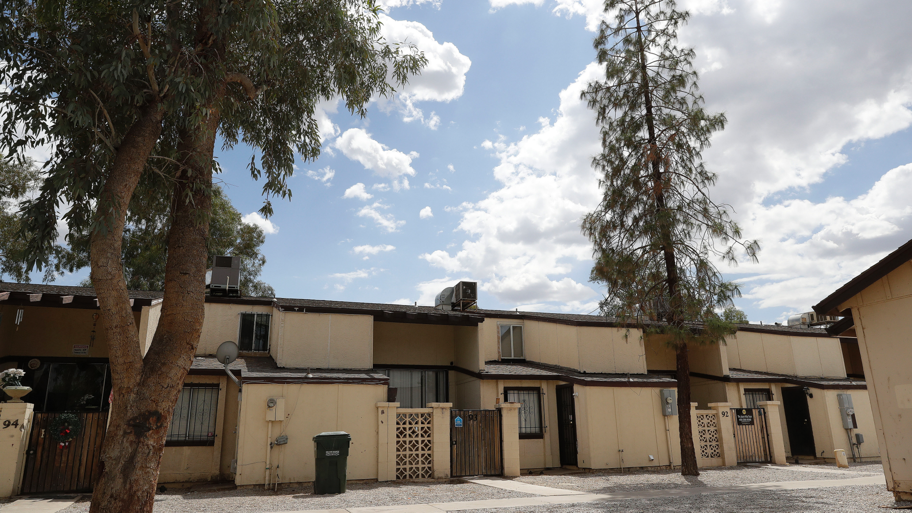 The house where a body was found murdered was shown Friday, April 12, 2019 in Phoenix Phoenix police announced the arrest of a man suspected of killing his wife, his two young daughters and a man suspected of being involved in a loving way with his wife. (AP Photo / Matt York)