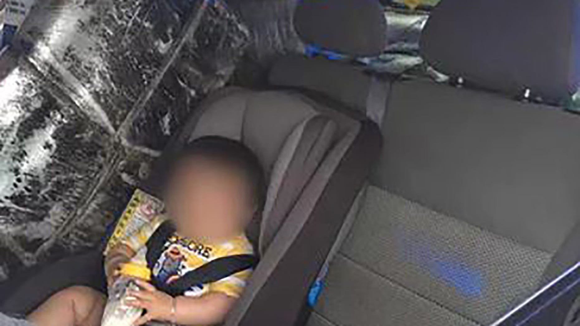 Agents found the baby next to 275 pounds of pot.