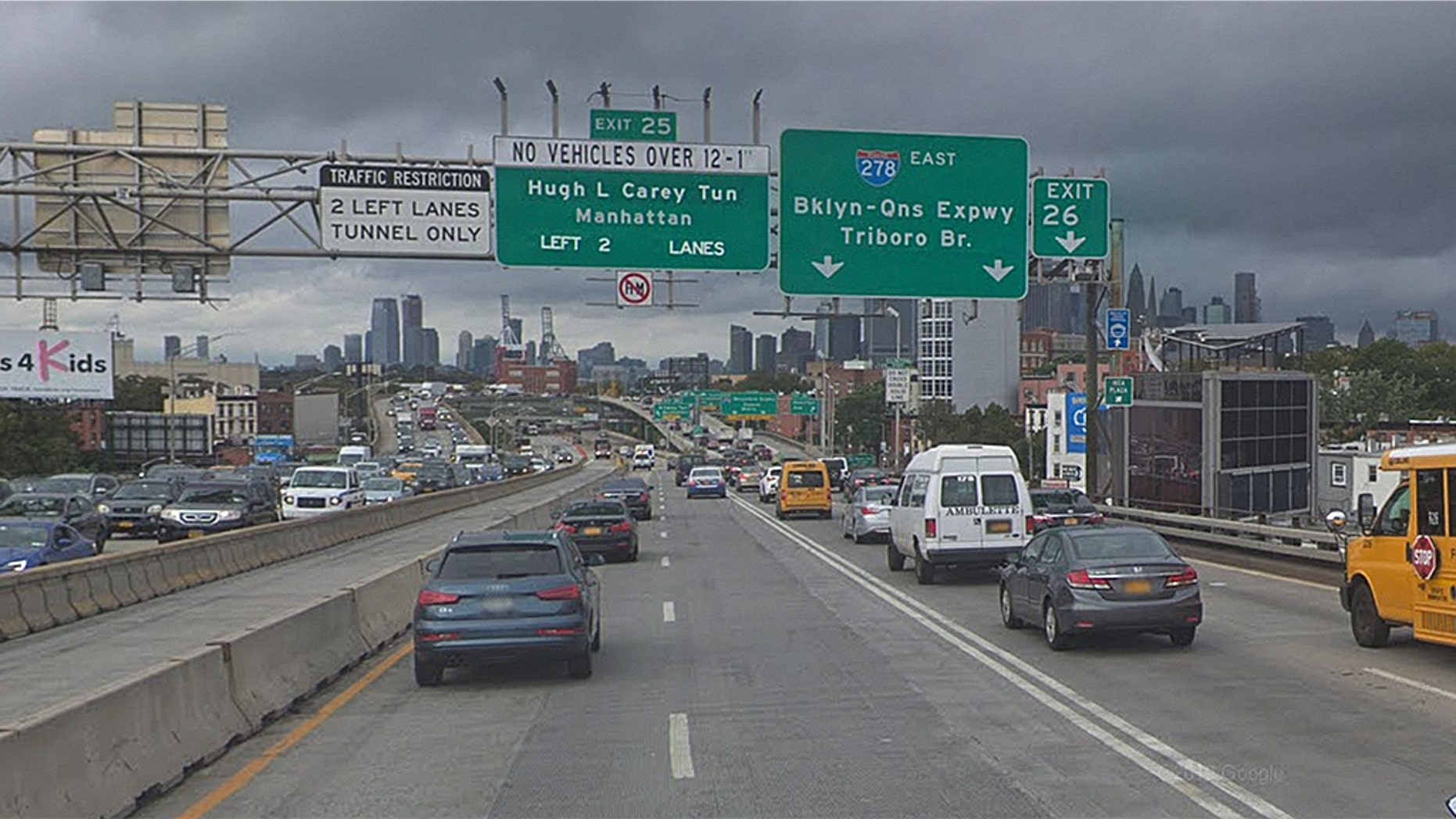 Cars traveling on the Brooklyn Queens Expressway. A cat was rescued hanging off the edge of the highway, thanks to a joint effort between Brooklyn students and the NYPD