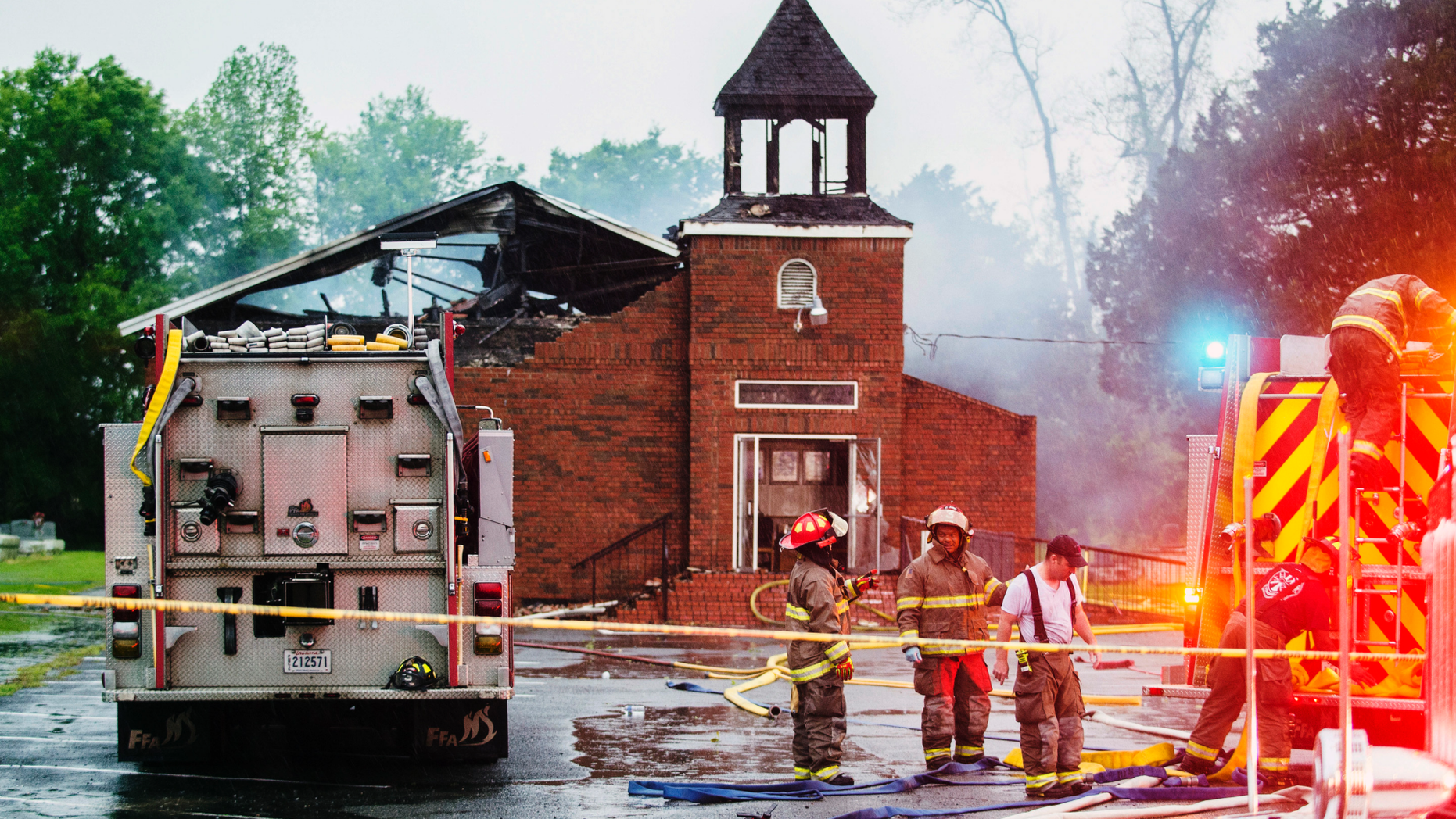 FILE - In this April 4, 2019 file photo, firefighters and fire investigators respond to a fire at Mt. Pleasant Baptist Church, in Opelousas, La. Authorities have arrested a person in connection with suspicious fires at three historic black churches in southern Louisiana, a federal prosecutor said. The suspect was in state custody, U.S. Attorney David C. Joseph announced late Wednesday, April 10 in a news release labeling the fires “despicable acts.” (Leslie Westbrook/The Advocate via AP, File)