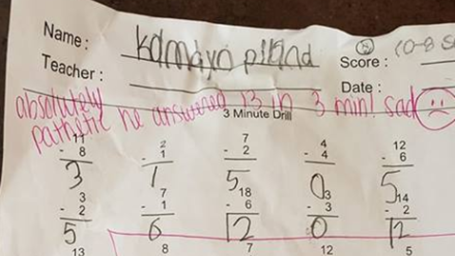 A Pennsylvania father shared an image of his son's math assignment with harsh comments written on top.