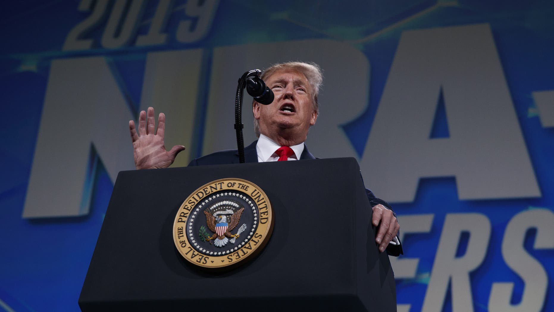 President Donald Trump speaks to the annual meeting of the National Rifle Association, Friday, April 26, 2019, in Indianapolis. (AP Photo/Evan Vucci)