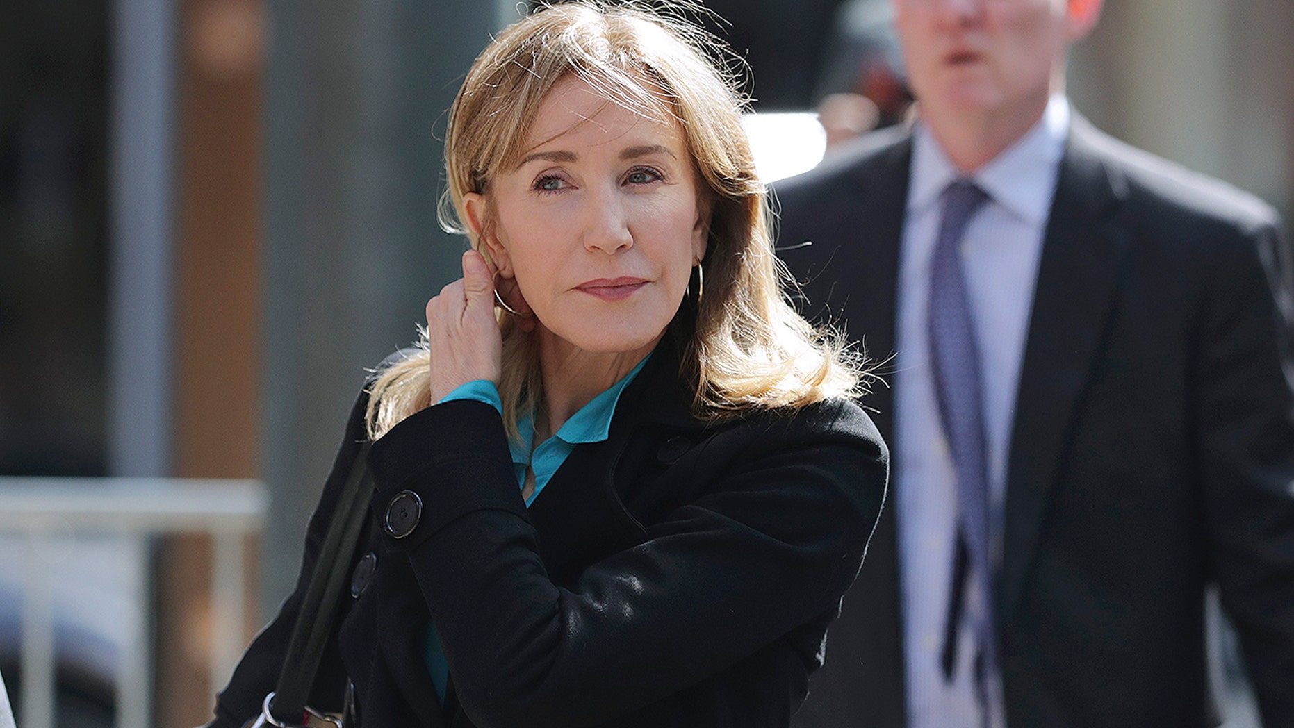 Actress Felicity Huffman appears in federal court in Boston on Wednesday, April 3, 2019 to face charges in connection with a corruption scandal at an American college. (Associated Press)