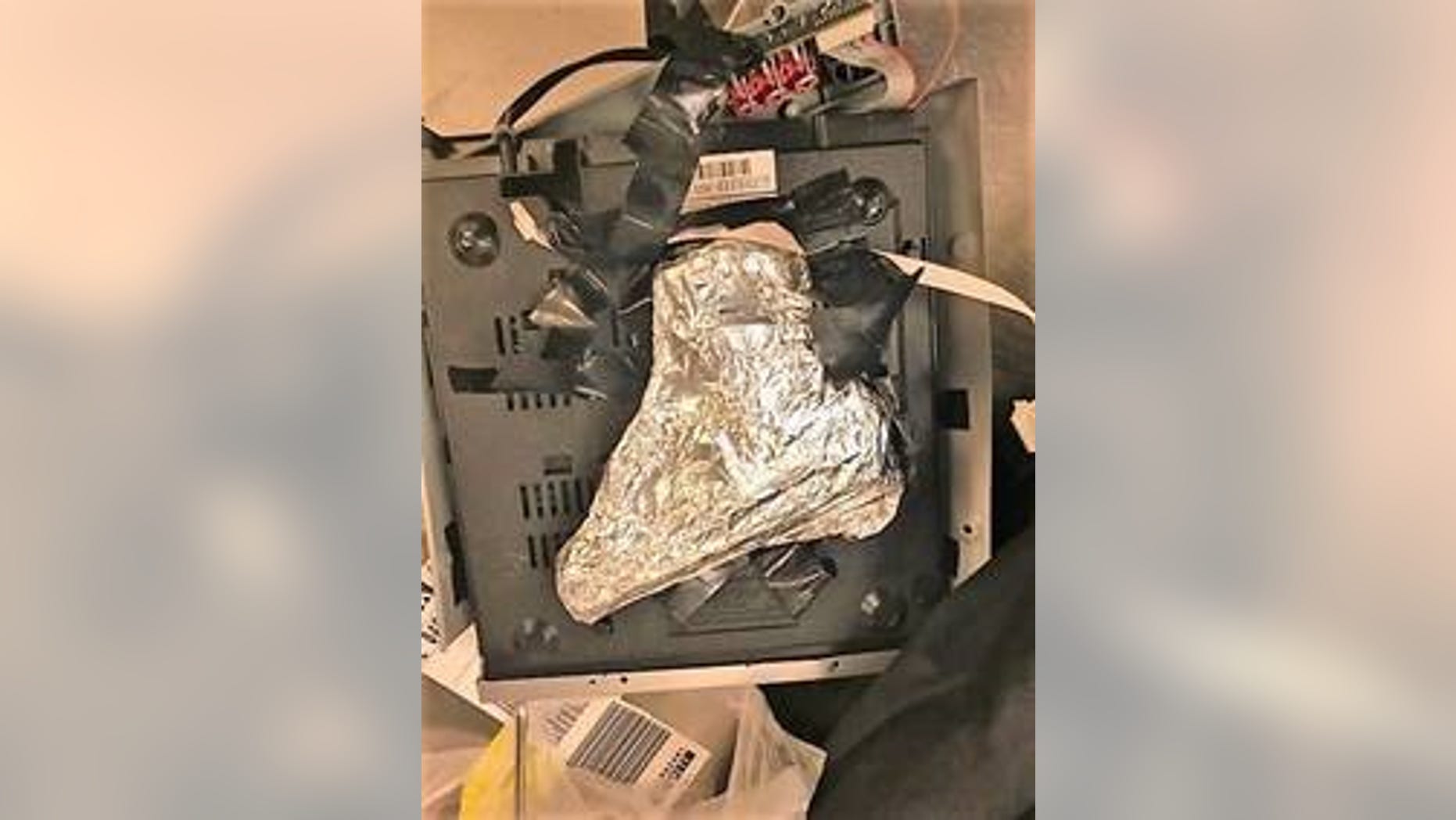 The 9mm was found wrapped in tinfoil and hidden inside a DVD player.
