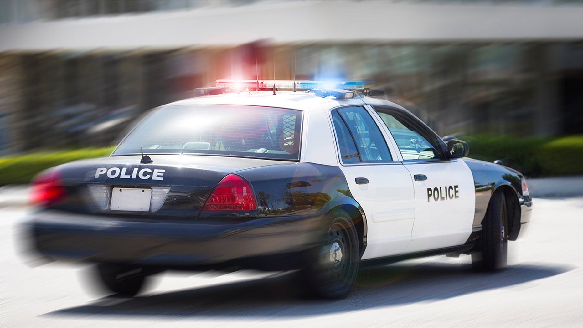 A police car races to the scene of an incident.