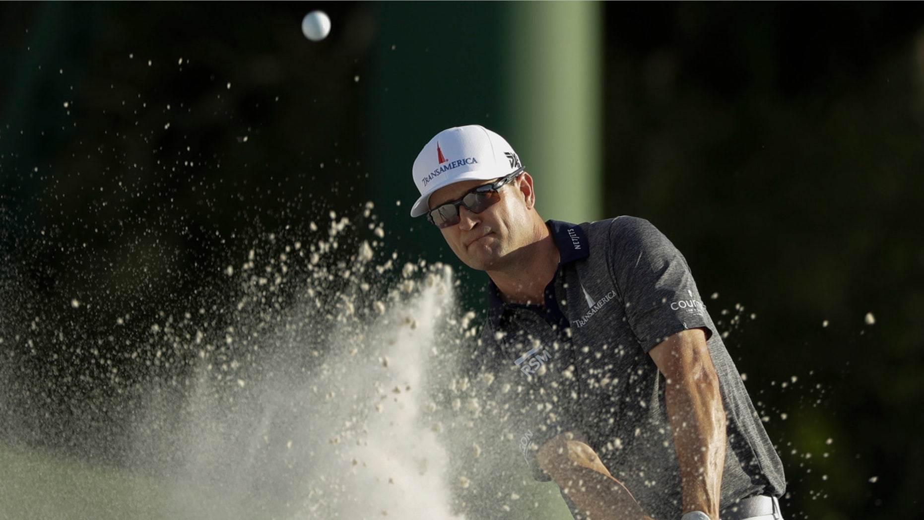 Zach Johnson hits on the 18th hole on Thursday during the first round for the Masters golf tournament in Augusta, Ga. (AP Photo/Marcio Jose Sanchez)