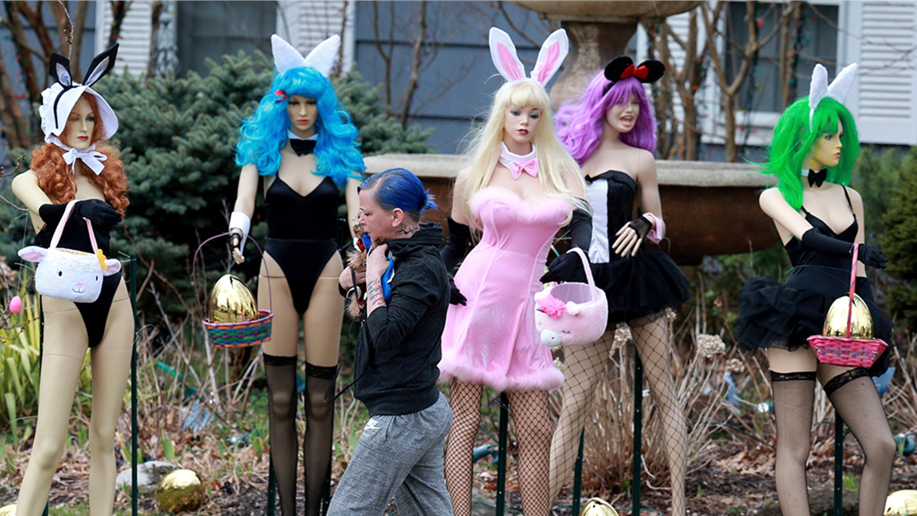 A New Jersey woman unhappy with her neighbor's racy Easter display used some garden shears to damage it. But the display's owner says it will soon be back up. The display has drawn mixed reviews from neighbors, as well as passers-by who stopped to take photos. ( Ed Murray/NJ Advance Media via AP)