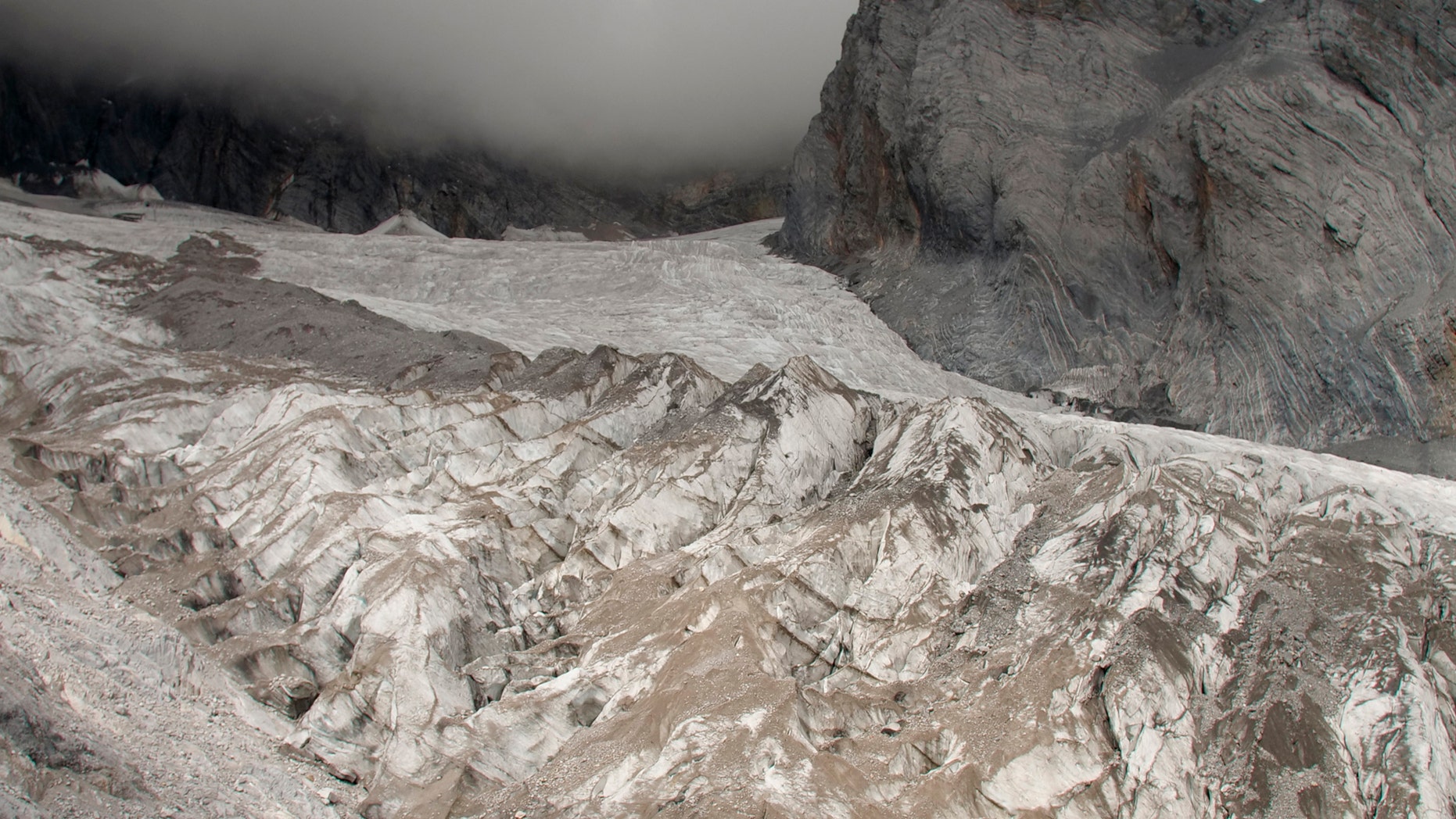 This Sept. 22, 2018 file photo shows the Baishui Glacier No.1 on the Jade Dragon Snow Mountain in the southern province of Yunnan in China. Scientists say it is one of the fastest melting glaciers in the world due to climate change and its relative proximity to the Equator. It has lost 60 percent of its mass and shrunk 250 meters since 1982. (AP Photo/Sam McNeil)