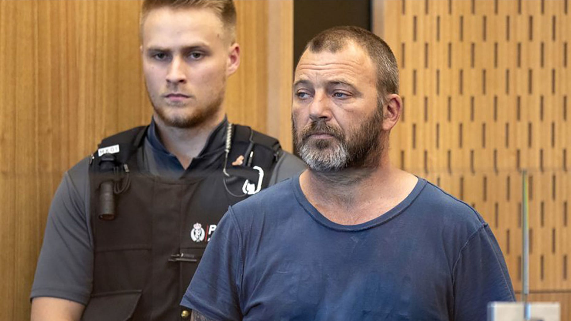 Philip Arps stands in the dock at the District Court in Christchurch, New Zealand on March 20. Arps has pleaded guilty to sharing a livestream video that was recorded by a gunman as he began killing 50 people at two mosques in New Zealand and will remain in jail until he’s sentenced on June 14. <br>