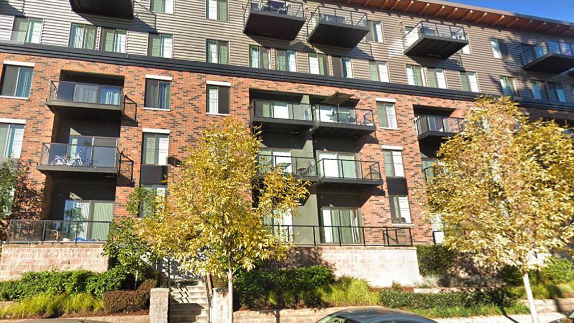 The little boy fell from the top floor of this Redmond apartment building Wednesday.