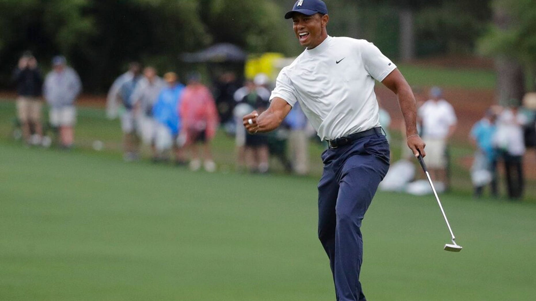 Tiger Woods reacts to his birdie putt on the 15th hole during the second round for the Masters golf tournament Friday, April 12, 2019, in Augusta, Ga.