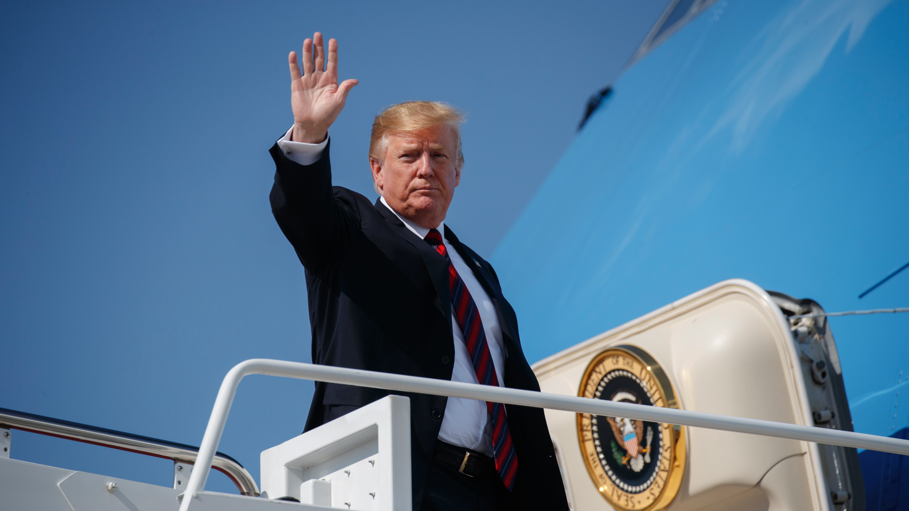 President Donald Trump waves as he boards Air Force One for a trip to New York to attend a fundraiser, Thursday, May 16, 2019, at Andrews Air Force Base, Md. (AP Photo/Evan Vucci)