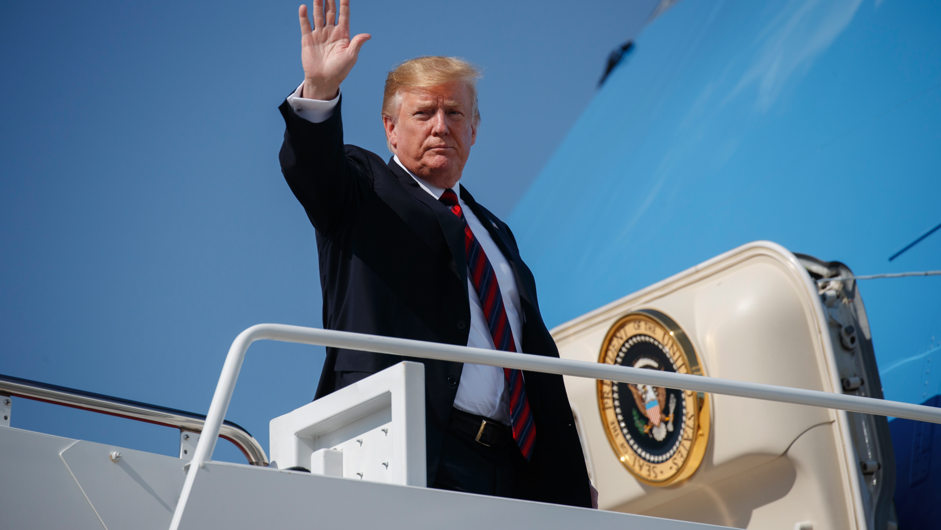 President Donald Trump waves as he boards Air Force One for a trip to New York to attend a fundraiser, Thursday, May 16, 2019, at Andrews Air Force Base, Md. (AP Photo/Evan Vucci)