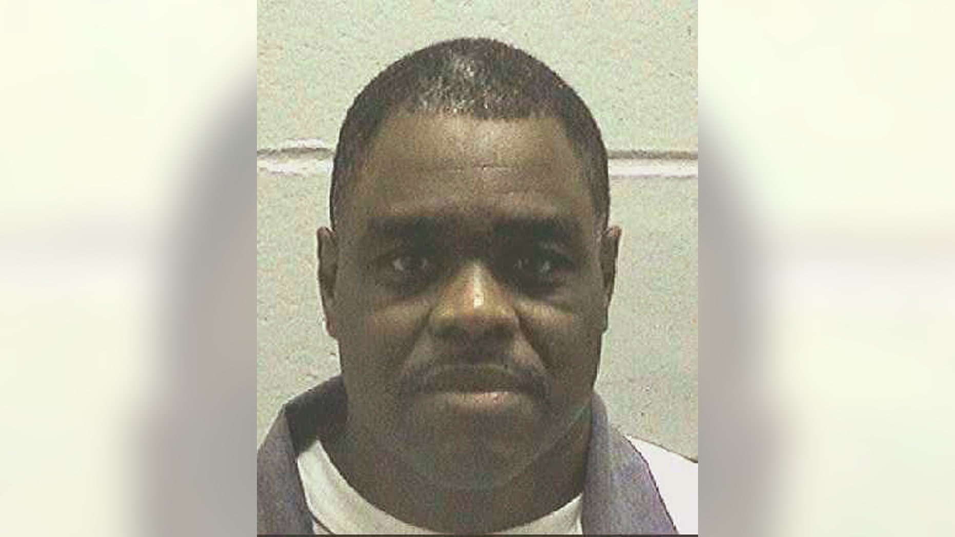 FILE - This undated file photo made available by the Georgia Department of Correction shows Scotty Garnell Morrow, who is set to die Thursday, May 2, 2019. When Morrow killed his ex-girlfriend and her friend nearly 25 years ago, his actions were spontaneous and emotionally fueled and shouldn't be punished by death, his lawyers argue. The State Board of Pardons and Paroles has scheduled a clemency hearing for Wednesday, May 1, 2019, and on Tuesday released a declassified clemency application submitted by Morrow's lawyers. (Georgia Department of Corrections via AP)